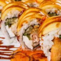 The Experience Roll · Shrimp tempura, cream cheese and cucumber inside, ripe mango outside, topped with sweet chil...