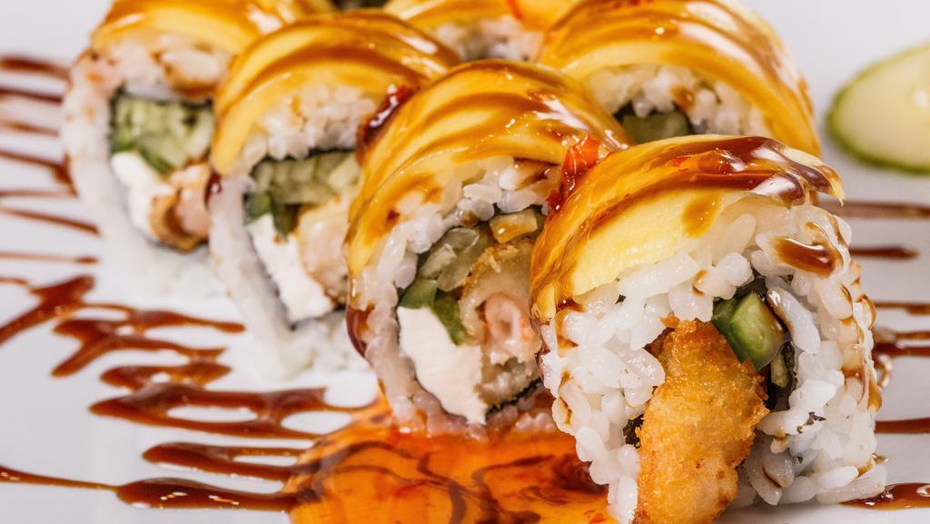 The Experience Roll · Shrimp tempura, cream cheese and cucumber inside, ripe mango outside, topped with sweet chili and eel sauce. Psychedelic.
