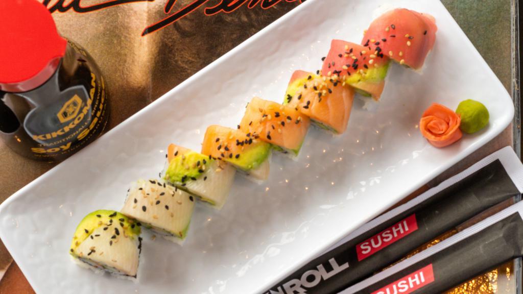 Rainbow Roll · California roll topped with red tuna, fresh salmon, yellowtail, avocado, and sprinkled with sesame seeds. Raw.