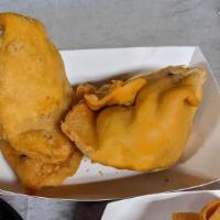 Samosa - 2 Pieces · Deep fried cone pastry filled potatoes and green peas.