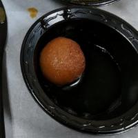Gulab Jamun · Golden fried balls of milk pastry soaked in sweet saffron syrup and served hot.