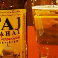 Taj Mahal - 11Oz · India- American-Style Lager- This is pale yellow in color with subtle malt aromas. The spicy...