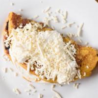 Cachapa Con Queso Y  Carne Mechada O Chiken · Sweet corn tortilla with your choice of white cheese  venezuelan-style shredded chicken, or ...