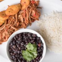 Pabellón · Carne mechada (venezuelan-style shredded beef), white rice, black beans topped with shredded...
