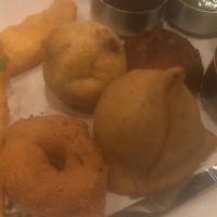 Assorted Appetizers Sampler Platter · A lavish gourmet medley consisting of medhu vada, potato bonda, vegetable samosa, vegetable ...