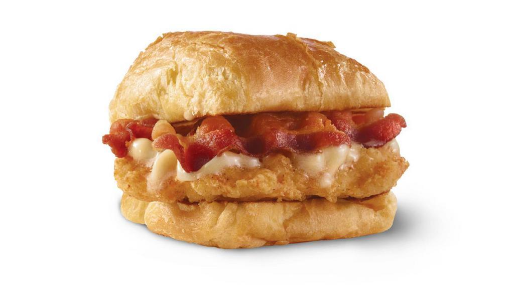 Maple Bacon Chicken Croissant · A juicy chicken breast, Applewood smoked bacon, and maple butter on a flaky croissant bun. A little sweet. A little savory. A lot good.
