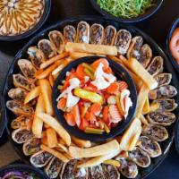 Mix Arabi Family Meal (2 Choice Of Meats) · Ideal for 4+ People | Our Famous Shawarma with your choice of 2 different type of Meats, wra...