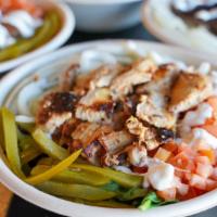 Chicken Shawarma Salad · Lettuce topped with chicken shawarma, garlic sauce, tomatoes and pickles.