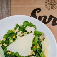 Di Spinaci · baby spinach, corn, shaved grana padano, lemon dressing