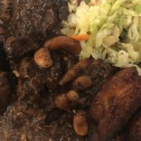 Oxtails · Marinated, braised and stewed with butter beans. Served with your choice of rice and peas or...