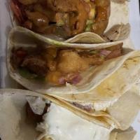 Korena Bbq Tacos · with Charred Napa Cabbage, Tomitillo, Avocado,, Cilantro, Gochujang Sauce