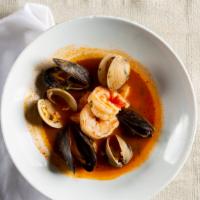 Peruvian Fish Stew · Shrimp, scallops, mussels, clams, lime, cilantro, and crustini.