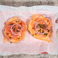 Nova Bagel · Toasted Bagel of your choice with plain cream cheese, Nova Salmon, capers, tomatoes, and oni...