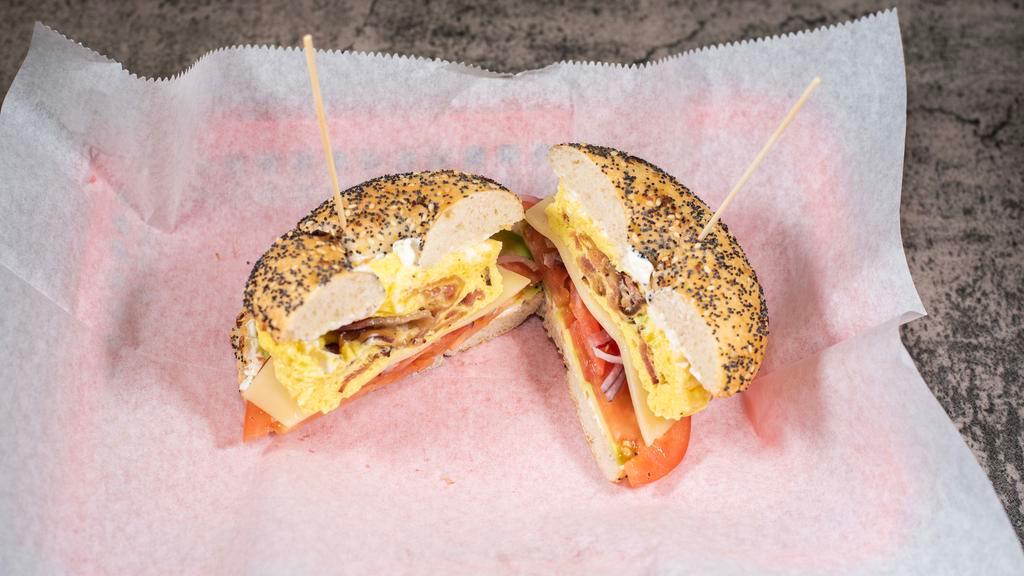 West Coast Bagel · Toasted bagel of your choice with two scrambled eggs, bacon, swiss cheese, avocados, red onions, and our scrumptious veggie cream cheese.