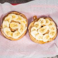 Elvis Bagel · Toasted bagel of your choice w/ peanut butter,  bananas, and honey