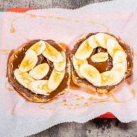 The Elvis 2.0 · Toasted Bagel of your choice with Nutella, Bananas, and honey