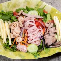 Chef Salad · Spring mix, carrots, cucumbers, onions, tomatoes, Swiss cheese, ham, roast beef and turkey.
