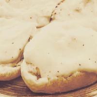 Biscuits N Gravy · 2 open faced biscuits covered in plain gravy