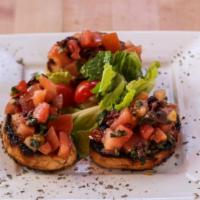 Bruschetta · Fresh bread, toasted and served with diced tomatoes, basil, olive oil, and olives.