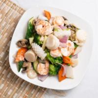Seafood Delight · Shrimp, scallops, and squid stir-fried with vegetables in white sauce.