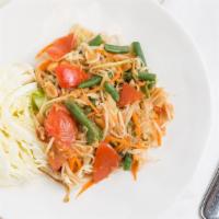 Papaya Salad · Green papaya salad, green bean, tomato, Thai chili, peanut in tangy Thai-style sauce.