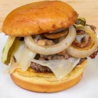 Executive · C.A.B. burger patty topped with shaved Philly steak, sautéed mushrooms & onions, Swiss.