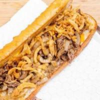 The Kitchen Sink · Loaded with steak, onions, mushrooms, Super Melty Cheese (American) & Swiss, and topped with...