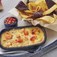 Langostino Lobster-Artichoke-&-Seafood Dip · Langostino and Maine lobster with spinach in a three-cheese blend. Served with yellow and bl...