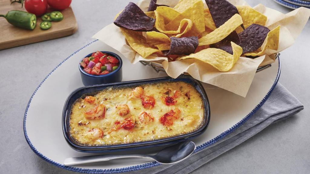 Langostino Lobster-Artichoke-&-Seafood Dip · Langostino and Maine lobster with spinach in a three-cheese blend. Served with yellow and blue corn tortilla chips and pico de gallo.. 890 Cal