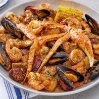 New! Bayou Seafood Boil · Snow crab legs, shrimp, mussels, sausage, blackened chicken, corn and potatoes tossed in a B...