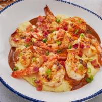 New! Shrimp & Grits · Grilled shrimp with blackening seasoning served over
creamy cheese grits in a spicy creole s...
