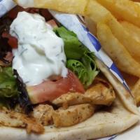 Chicken Gyro · Greek-style seasoned grilled chicken wrapped in a pita with lettuce, tomato, and a side of t...