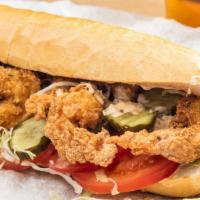 Shrimp Po Boy  · Crispy fried shrimp breaded and fried then piled onto a french roll with lettuce, tomato, an...