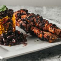 Chicken Kabob · 5 oz. skewers.  Beautifully seasoned. Chargrilled served over a bed of cinnamon Basmati rice...