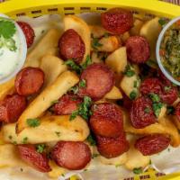Salchipapas · Stir fry sausages combine with French fries, topping with Lola's sauce and mix of veggies.