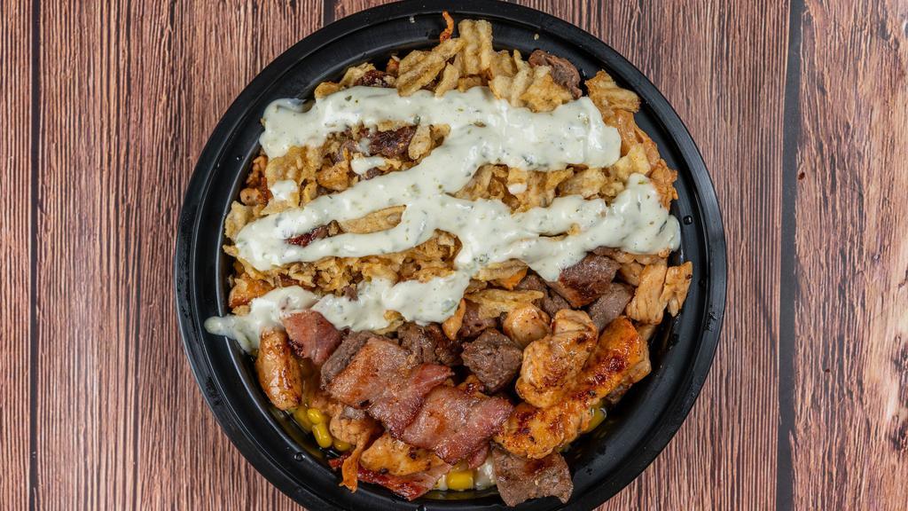 Maicito - Corn Bowl · Sweet corn, your favorite Lola's sauce, banging grilled chicken, awesome grilled steak, crispy bacon. All that smothered in melted cheese then topped off with hand crushed potato chips.