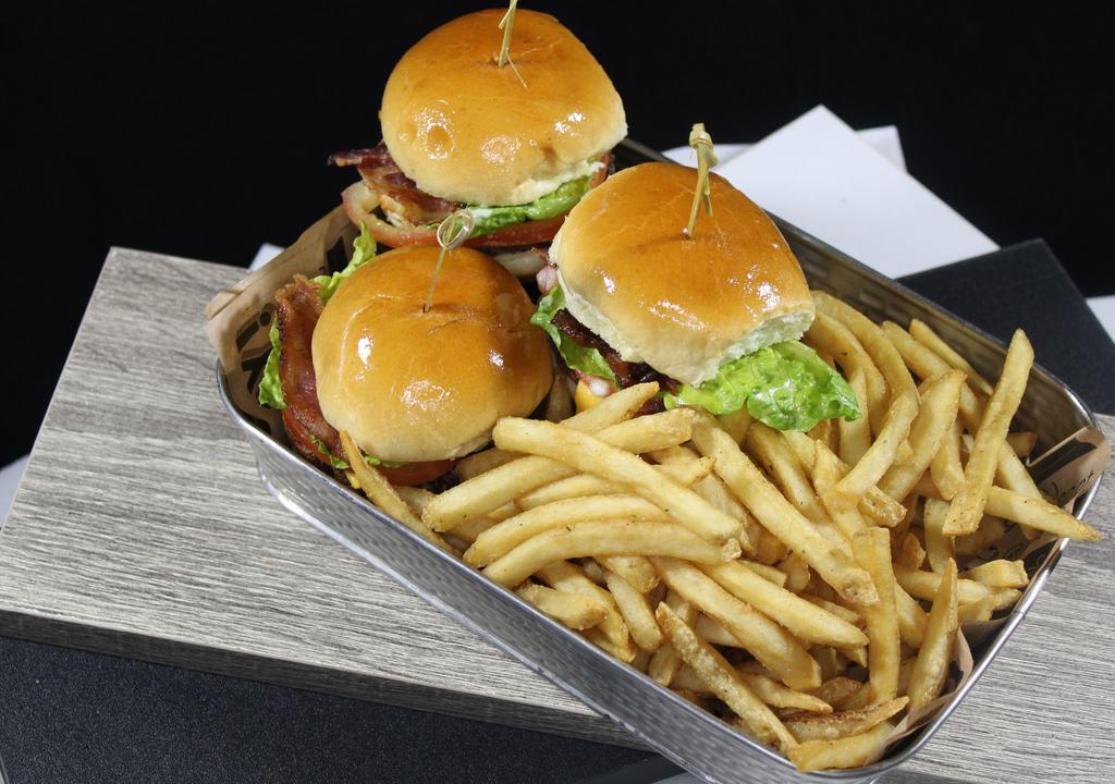 Bacon Cheeseburger Sliders (1510 Cal) · Three mini burgers topped with Applewood smoked bacon, American cheese, leaf lettuce, tomato & our signature burger sauce on brioche buns.
