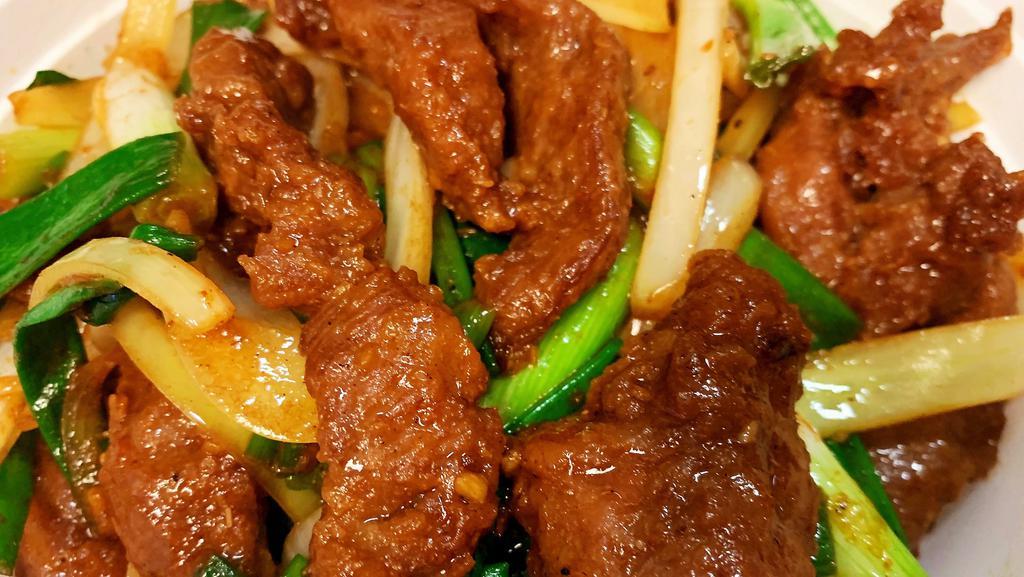 Mongolian Beef · Sliced tender beef marinated with green onions in Mongolian sauce (highly recommended).