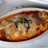 Lasagna · Layered pasta, our homemade meat sauce and ricotta cheese covered with melted mozzarella che...