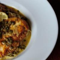Chicken Piccata · Boneless breast of chicken sauteed with butter and lemon in a white wine sauce with capers. ...