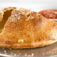 Cheese Calzone · Stuffed with ricotta and mozzarella cheese.  Baked 'til golden brown and served with side of...