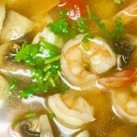 Tom Yum Soup · Traditional hot and sour soup with lemon grass, galanga, mushroom, cilantro and lime juice.