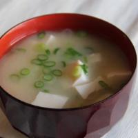 Miso Soup · Delicate broth with miso, tofu, scallions, and seaweed.