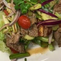 Spicy Beef Salad · Grill beef, onion, scallion,cucumber,tomato  and fresh lime juice in Thai seasoning.