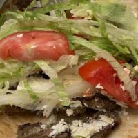 Gyro Wrap Combo · Stips of gyro meat, topped with lettuce, tomatoes, onions, and tzatziki sauce.