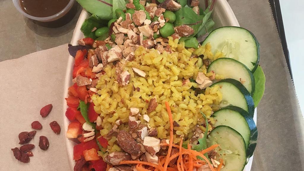 Eat The Rainbowl · Coconut brown rice, carrots, peppers, cucumbers, edamame, almonds, mixed greens, goji-cranberry dressing.