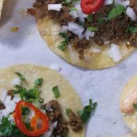 Mexican Street Tacos · 3 tacos. Beef-chorizo mix topped with fresh cilantro and onion.