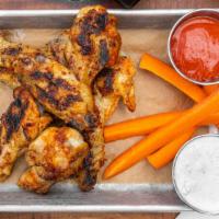 Springer Mountain Wings · an 8 pack of wings with a choice of sauces.  served with carrots and either ranch or blue ch...