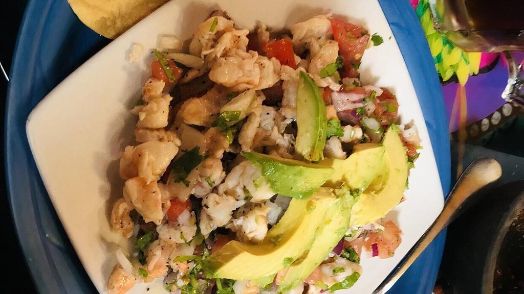 Tostadas De Ceviche · Delightful pieces of shrimp in a well-seasoned lime sauce, topped with pico de gallo and avocado. Served with two flat fried corn tortillas.