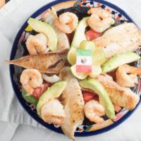 Molcajete Del Mar · For two. Grilled tilapia and shrimp with grilled veggies and slices of avocado. Served with ...